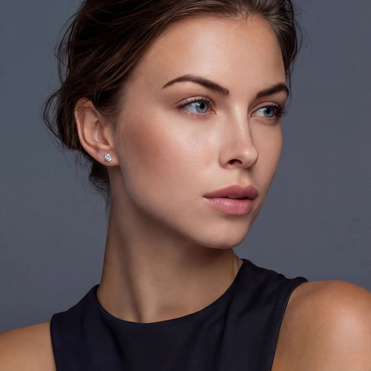 Model wearing a round moissanite stud earring for everyday styling