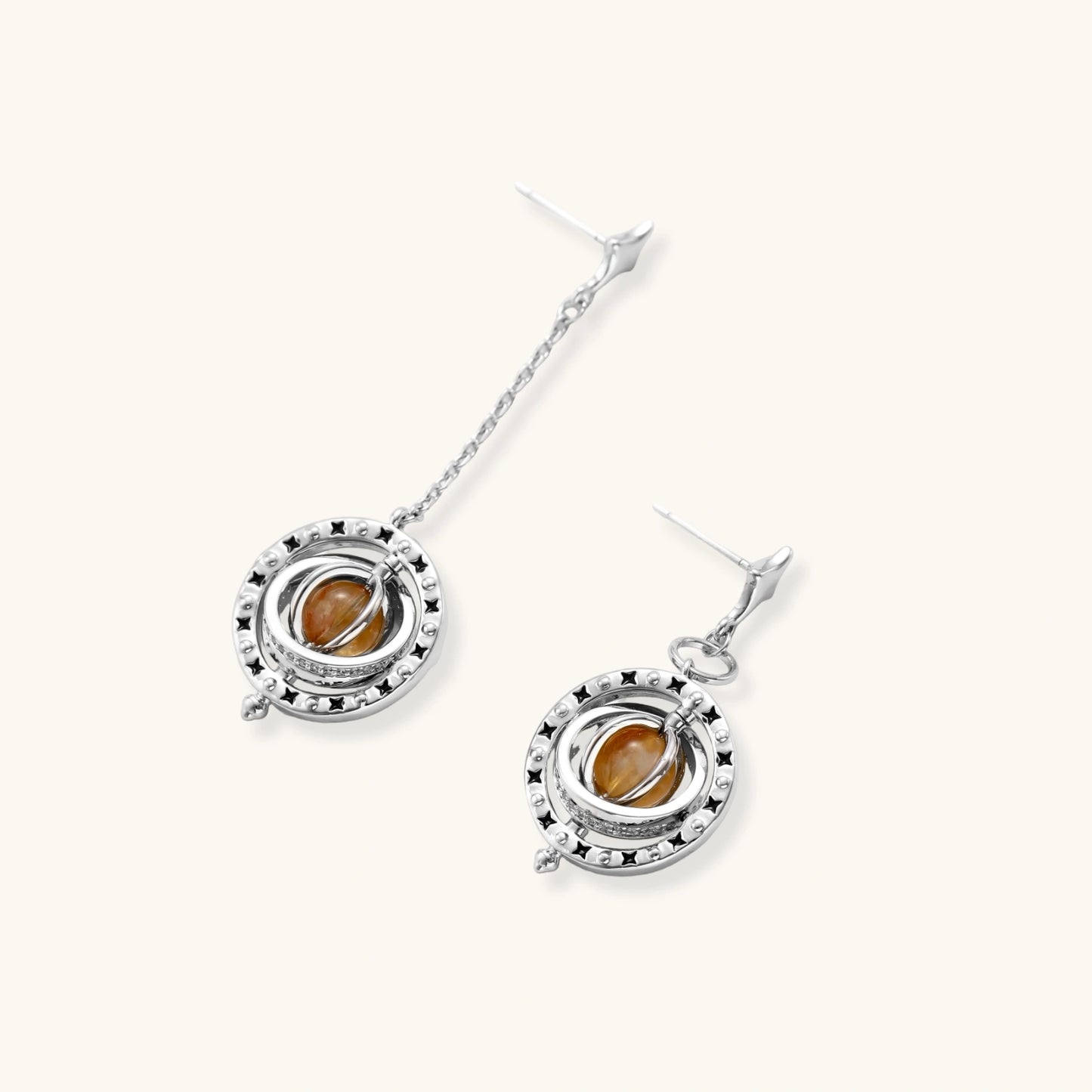 Complete jewelry set featuring citrine stone chips, silver beads, and cosmic circle pendants on cream background.