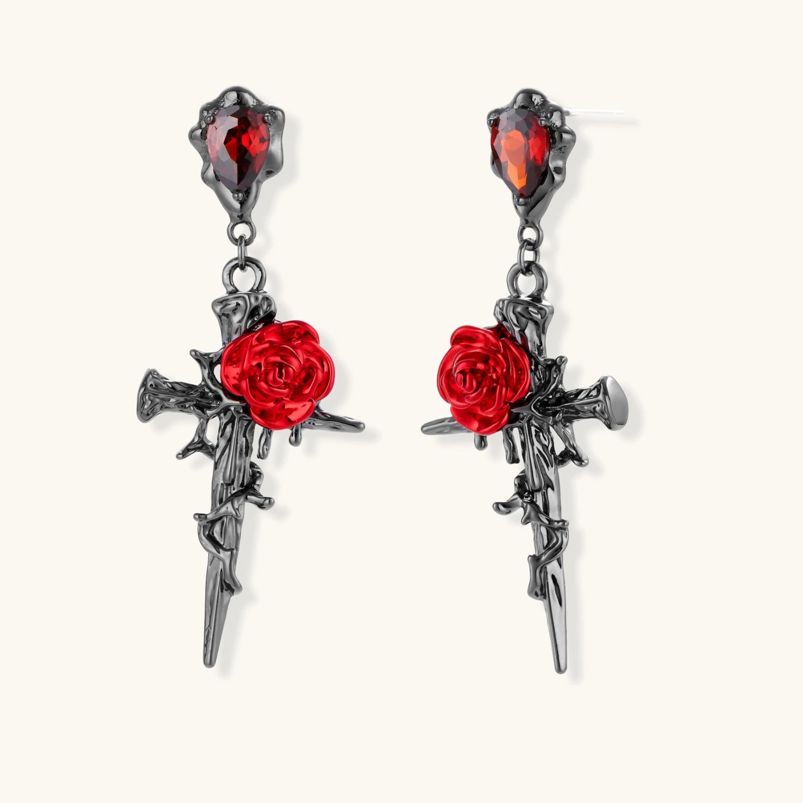 Gothic jewelry set with dark metal thorny cross pendants featuring red enamel roses and matching red crystal earrings