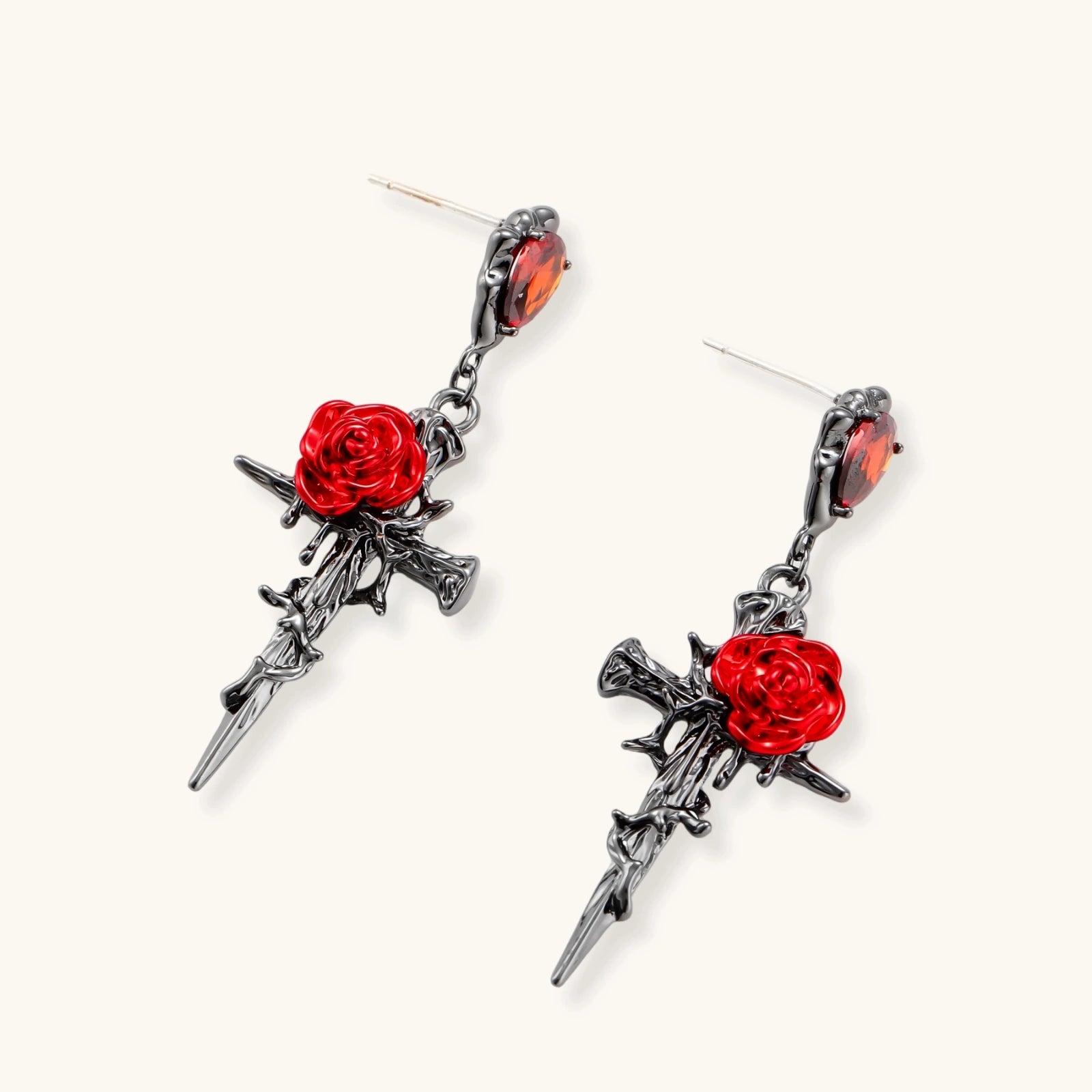 Gothic jewelry set with dark metal thorny cross pendants featuring red enamel roses and matching red crystal earrings